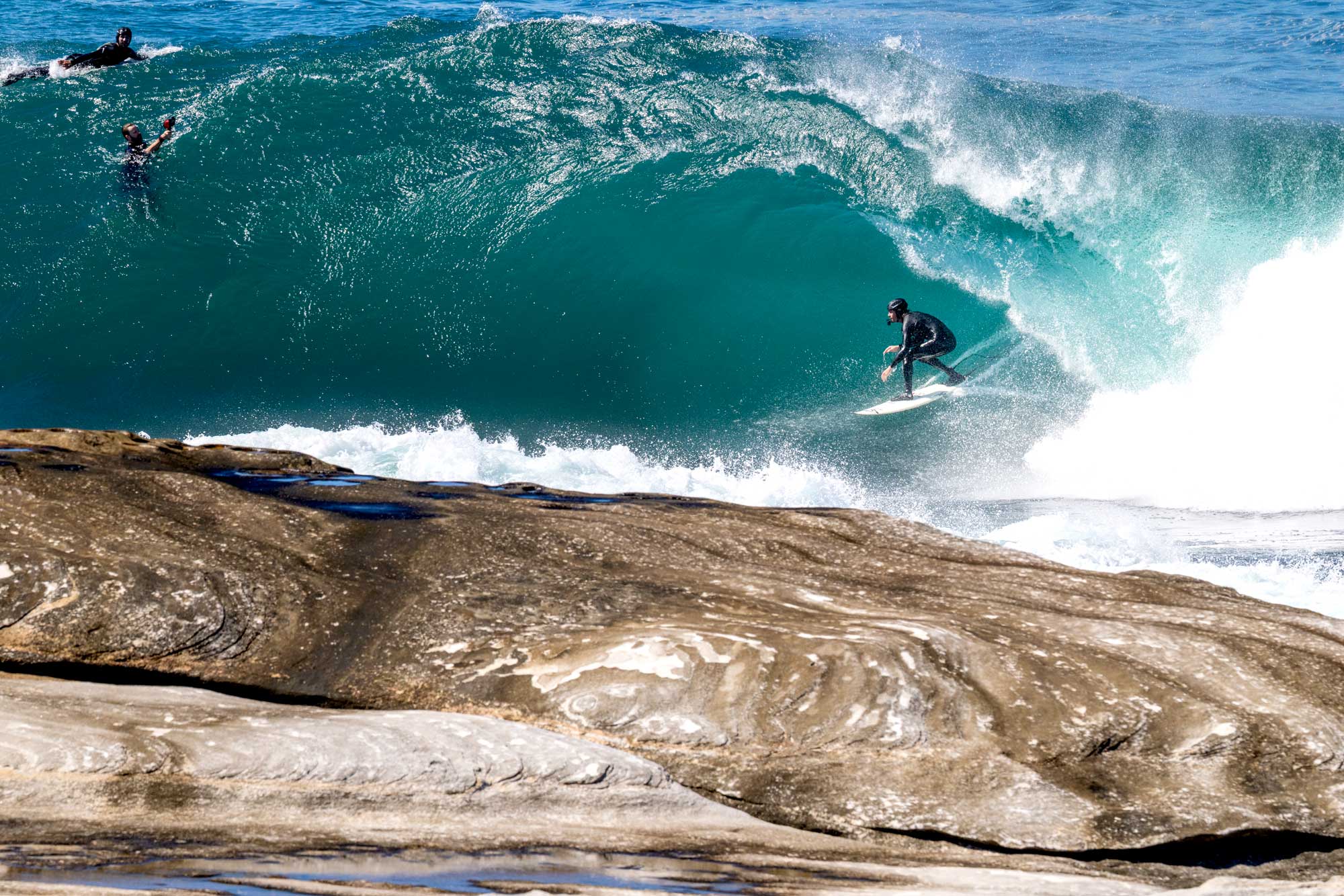 Surfer riding a clean right — sharing waves the right way